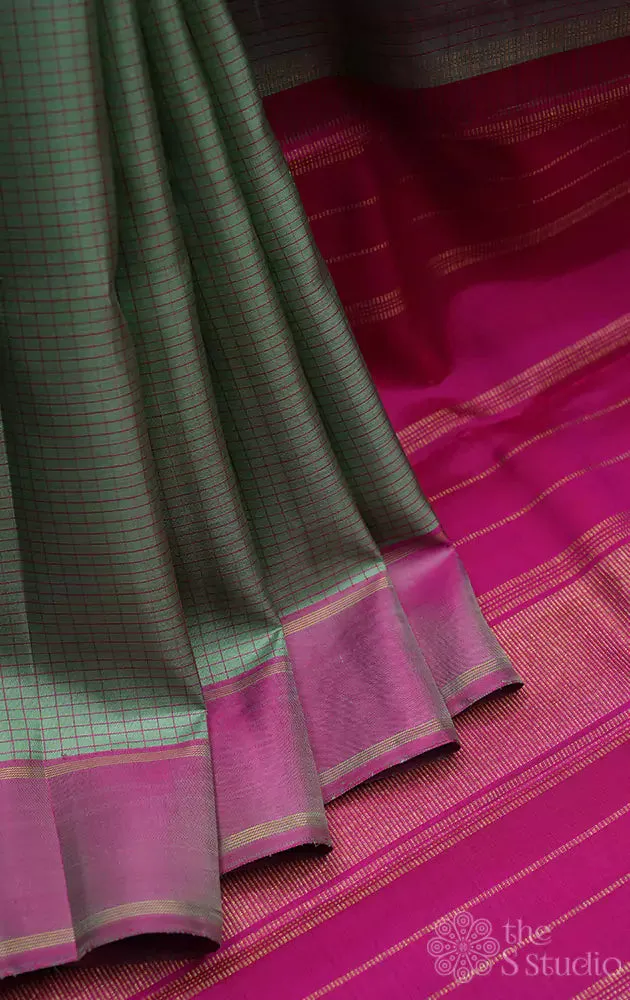 Mint green kanchi silk saree with pink border